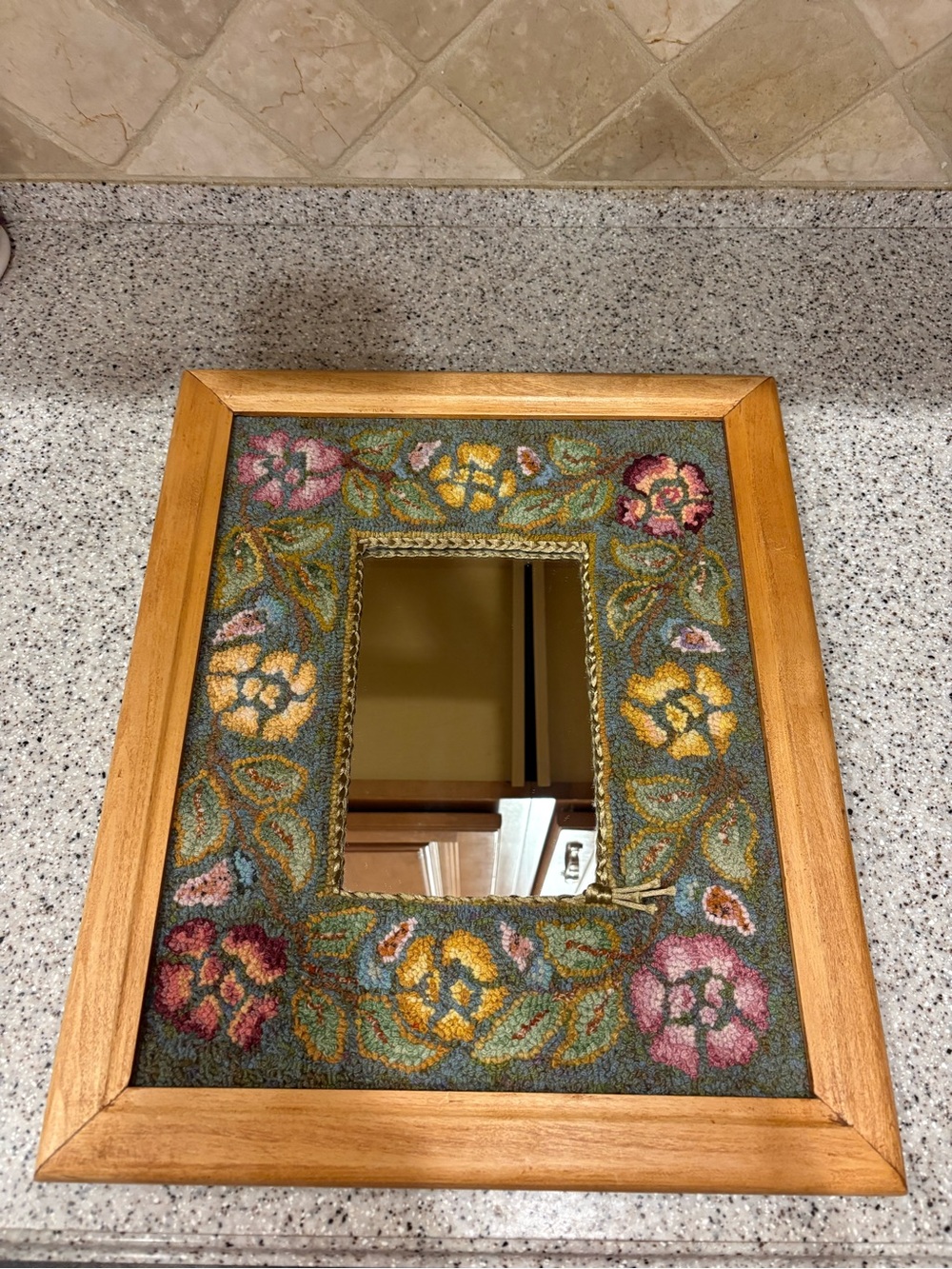 MHandmade wooden wall mirror features a colorful floral rug-hooked